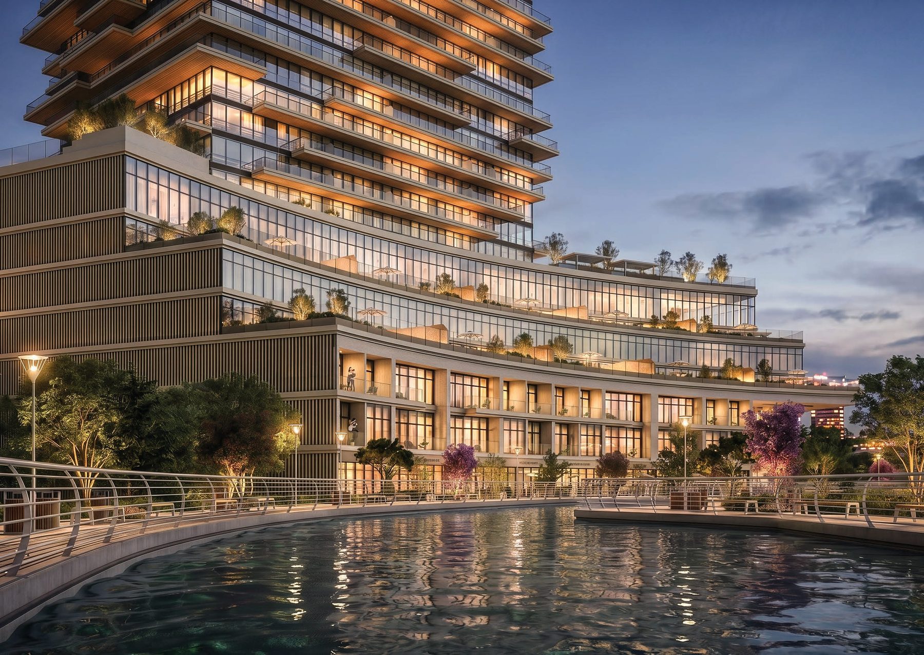 The podium of Radiant Terrace curving along the canal, with terraces above a waterside walk