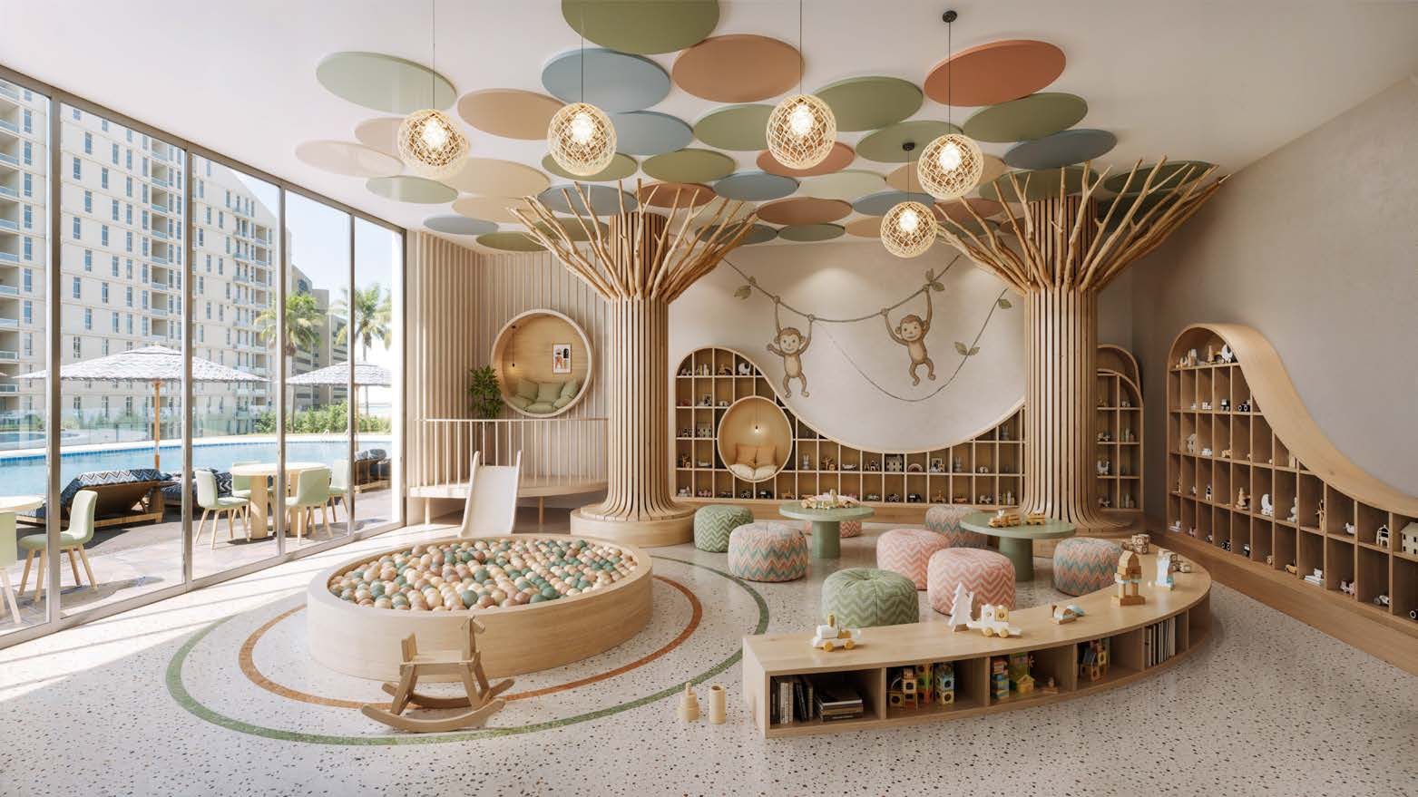 The kids' room at Waterfront by Missoni with a ball pit and a tree-like climbing structure
